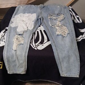 Distressed Blue Jeans with White Floral Design
